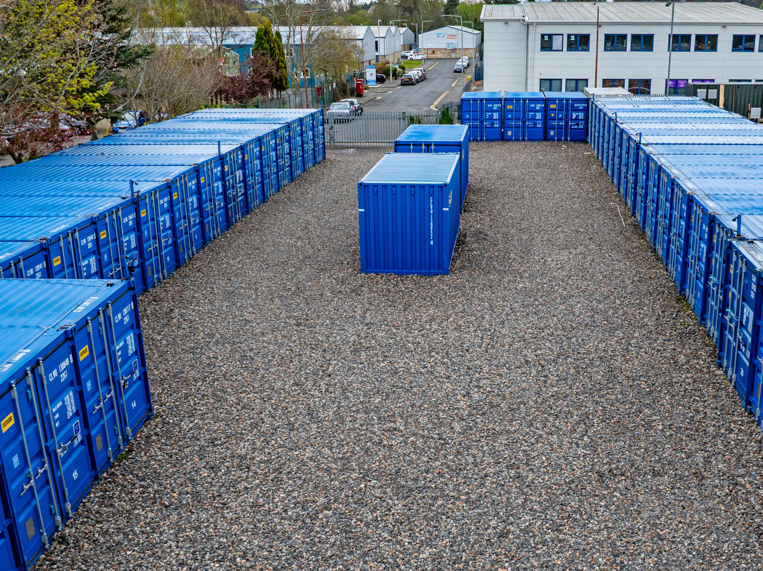 Row of 20ft drive-up storage containers at Boxxs Self Storage in Linlithgow, offering secure, weatherproof storage for households, tradespeople, and businesses.